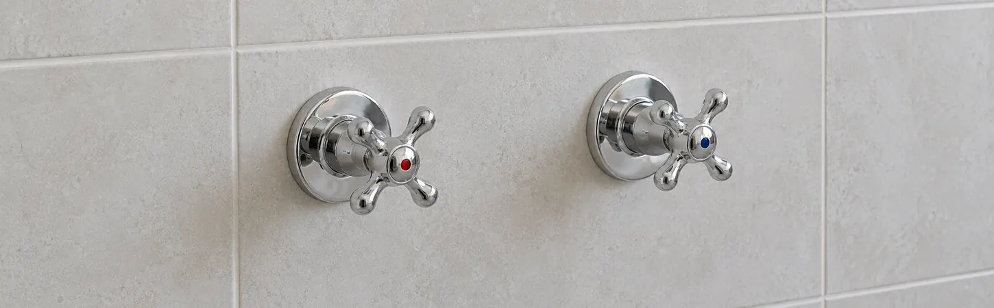 Conceptual illustration of existing hot and cold wall taps before a breech adapter conversion