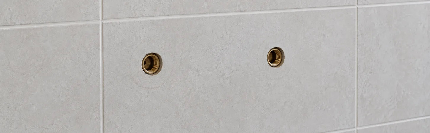 Conceptual illustration of recessed hot and cold tap-body openings with tap assemblies removed